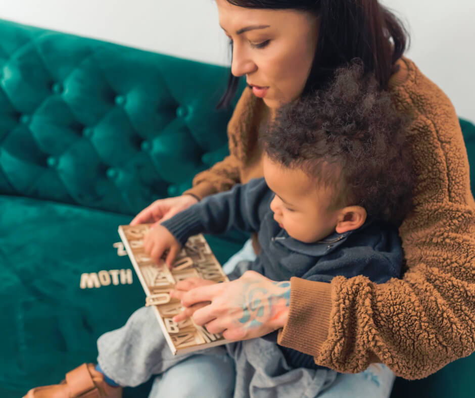 Parent and child reading together to support speech delays and language development